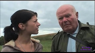 An elderly gentleman see a young girl in trouble with her car